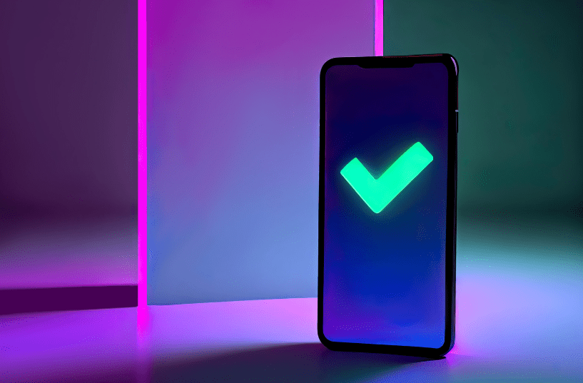 The completed app approval process, checkmark on the smartphone, to show the differences between Google and Apple approval processes