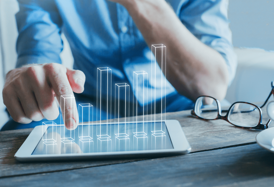 A businessman using a well-crafted app on their device to enhance their ROI.